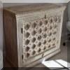 F37. Carved two-door cabinet. 38”h x 40”w x 18”d 